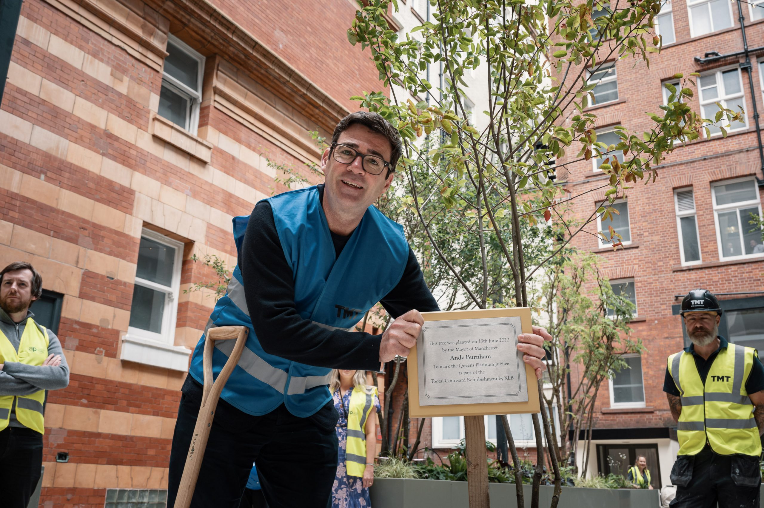 Mayor of Greater Manchester Andy Burnham planting tree to celebrate The Queen's Jubilee and The Tootal Transformation